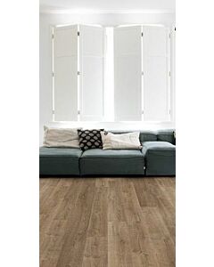Parquet laminado de roble riva marrón de la marca quick-step de la serie eligna en un ambiente de habitación.