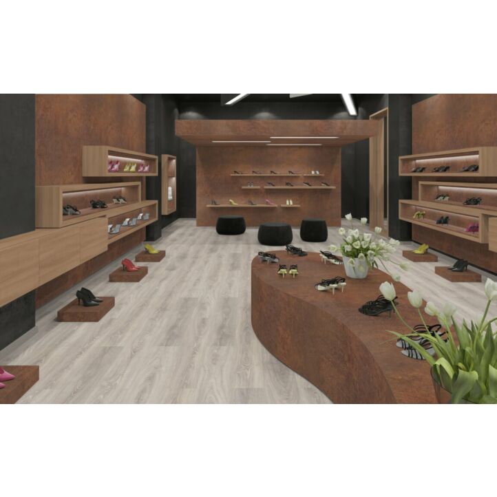 Parquet laminado de Roble Toscolano Claro EHL015 de Egger Home de 12mm de grosor, en un ambiente de local comercial.
