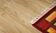 Parquet laminado de la marca pergo de la gama living expression roble beige clásico serie L0323-03359  en un ambiente de habitación.