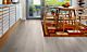 Parquet laminado de la marca pergo de la gama living expression roble cabaña serie L0323-03362 en un ambiente de habitación.
