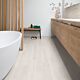 Parquet laminado de roble estado gris claro de la marca quick-step de la serie eligna en un ambiente de habitación.