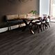 Parquet laminado de roble newcastle oscuro de la marca quick-step de la serie eligne en un ambiente de habitación.
