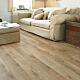 Parquet laminado de roble viejo aceitado mate de la marca Quick-Step de la serie Eligna en un ambiente de habitación