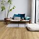 Parquet laminado de roble riva natural de la marca quick-step de la serie eligna en un ambiente de habitación.