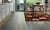 Parquet laminado de la marca pergo de la gama original excellence roble montaña rocosa L0234-03570 en un ambiente de habitación.