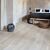 Parquet laminado de roble long island claro de la marca quick-step de la serie largo en un ambiente de habitación.