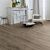 Parquet laminado de roble bosque marron de la marca quick-step de la serie majestic en un ambiente de habitación.
