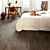 Parquet laminado de robe clásico marrón de la marca quick-step de la serie impressive ultra en un ambiente de habitación.